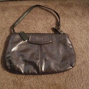 Metallic silver coach clutch